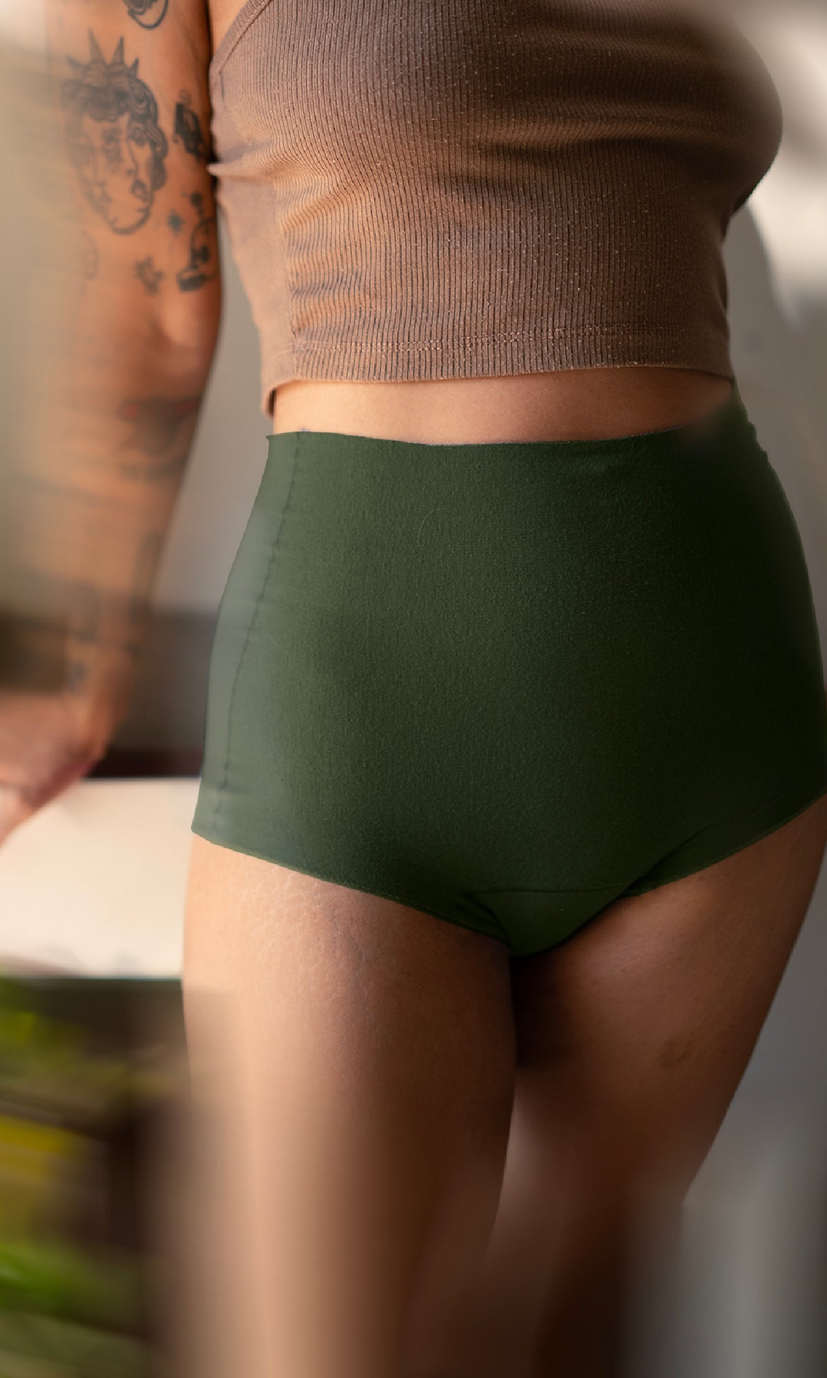 High-rise dark green women’s liberate underwear -— seamless, soft, and supportive for everyday comfort.